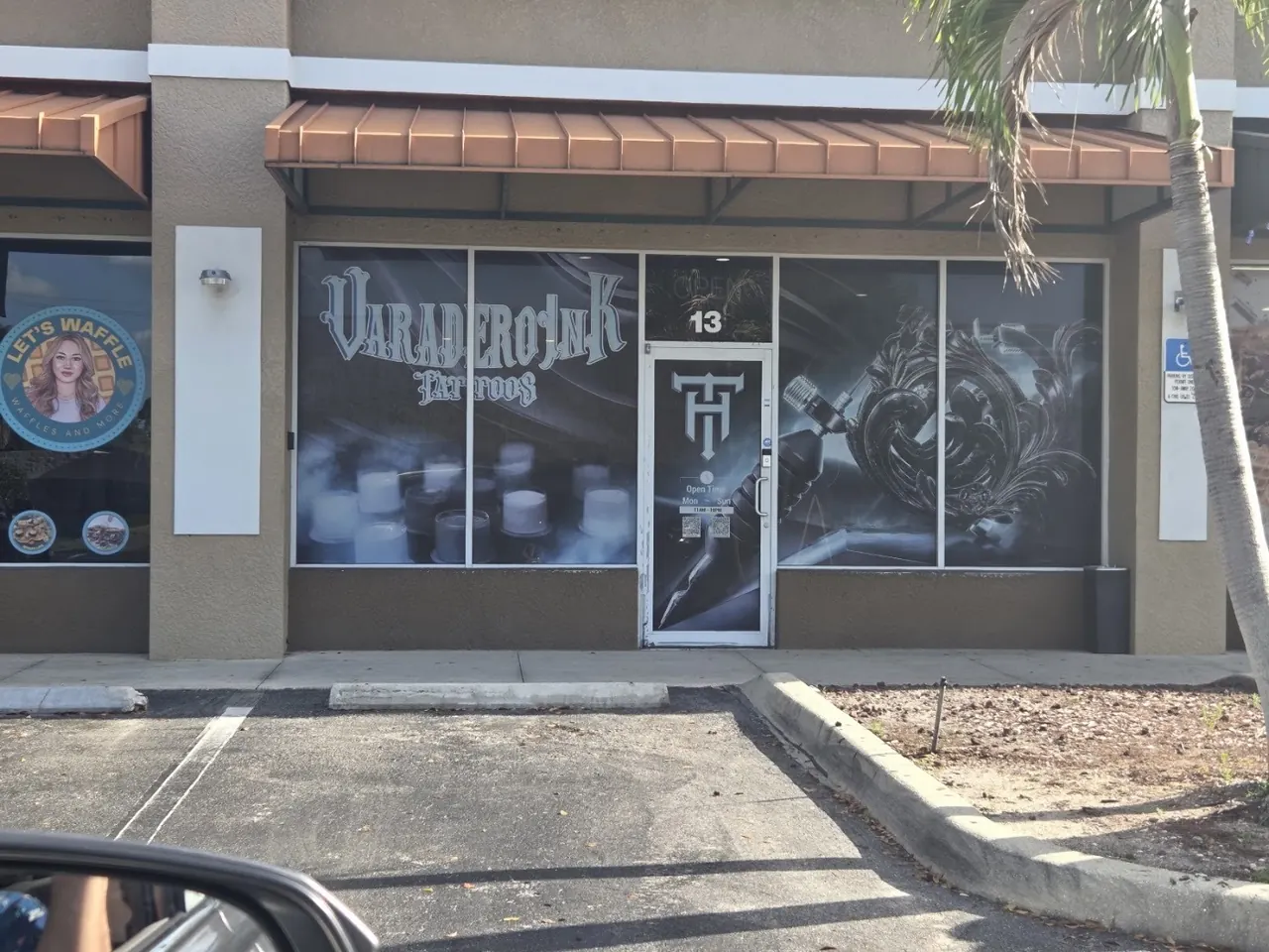 Storefront of Varadero Ink Tattoos, unit 13, in the plaza on Santa Barbara Blvd